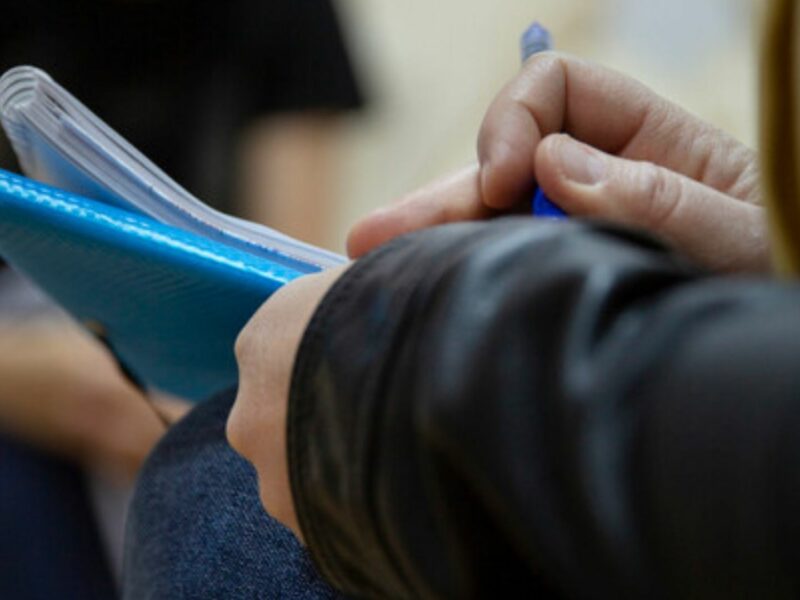 One of our social workers taking notes on a case