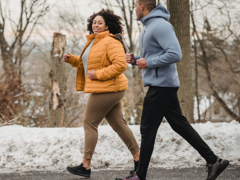 A man and a woman running to raise money for Hope and Homes for Children