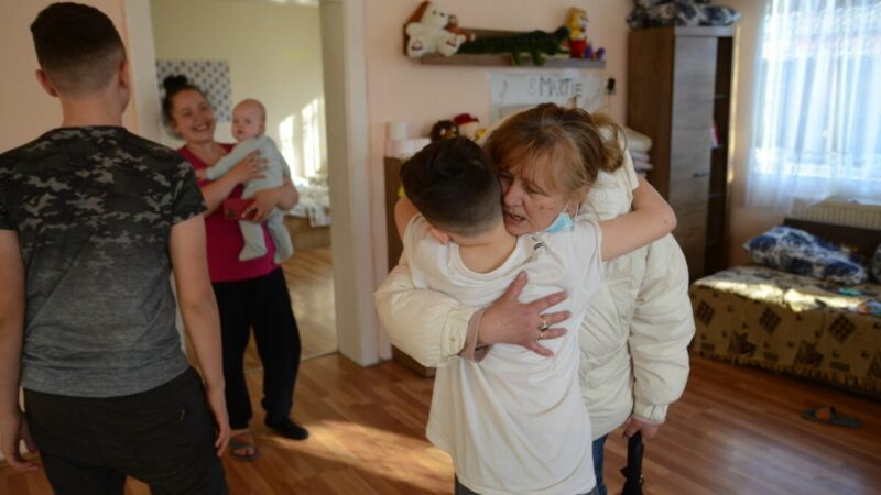 A woman hugs a child at a centre in Romania.