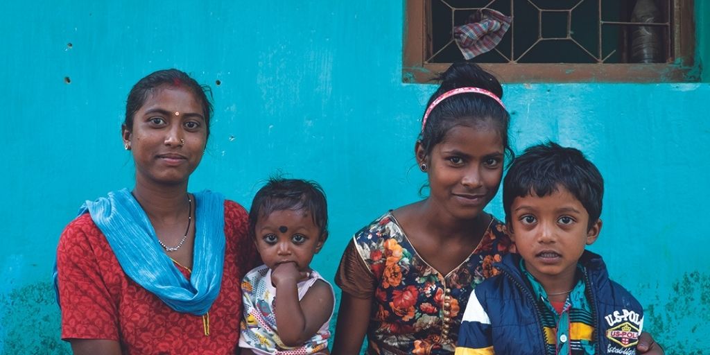 Jacinta and her family smiling