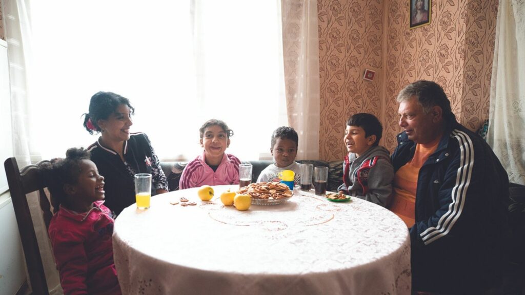 Maria, Kaloyan and their parents at the kitchen table