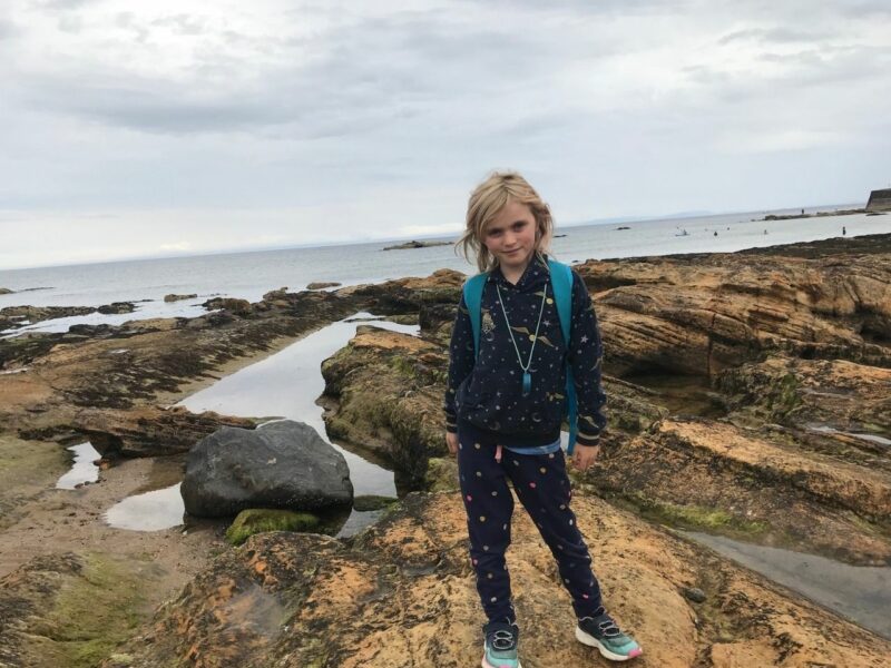 Martha standing in a field during her epic 10 mile walk to raise money for Hope and Homes for Children