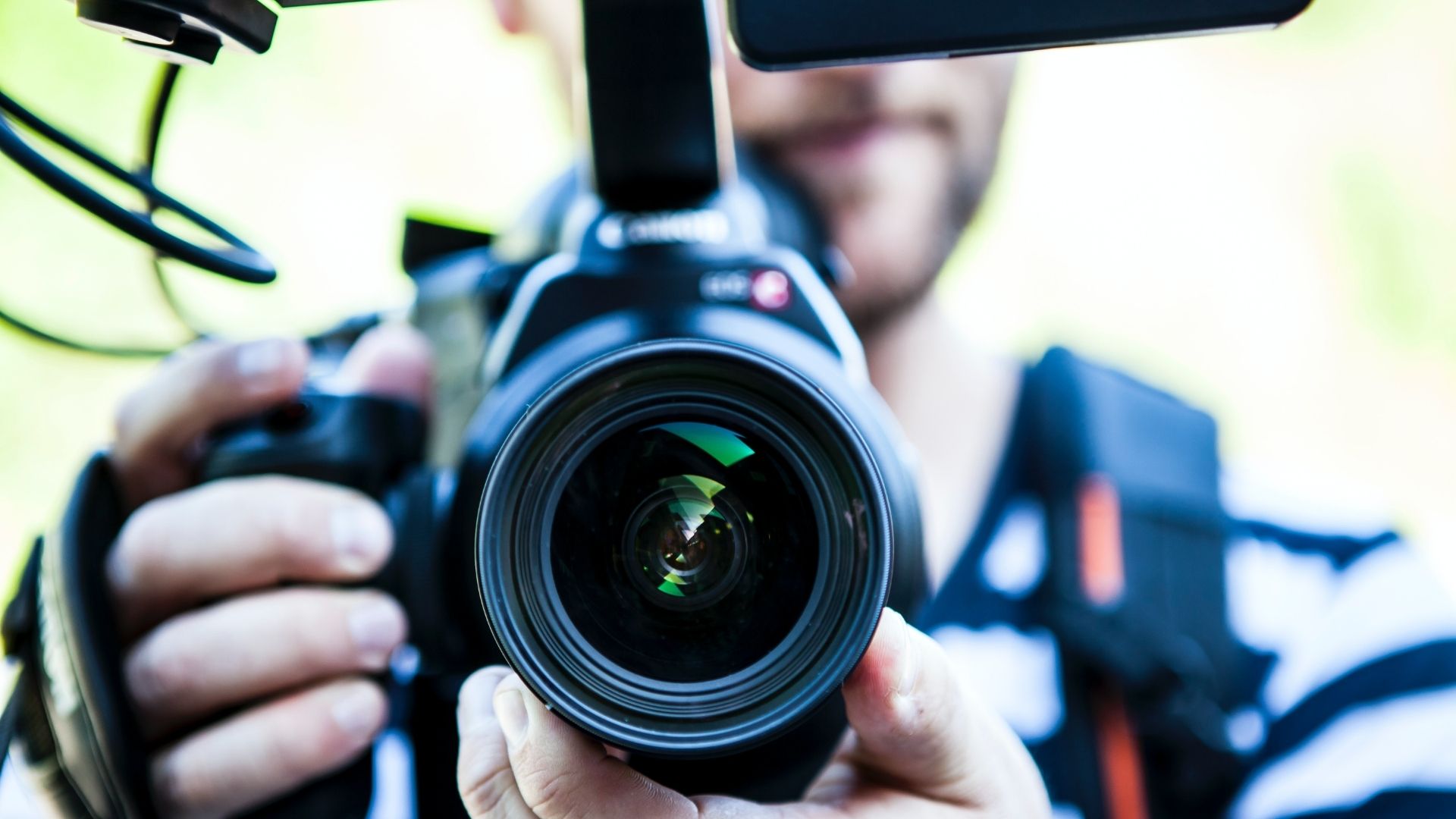 A photographer pointing the camera