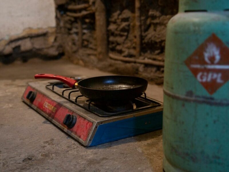 A gas canister in the foreground used to fuel the cooker on the floor. This is in the home of one of the families we work with in Romania