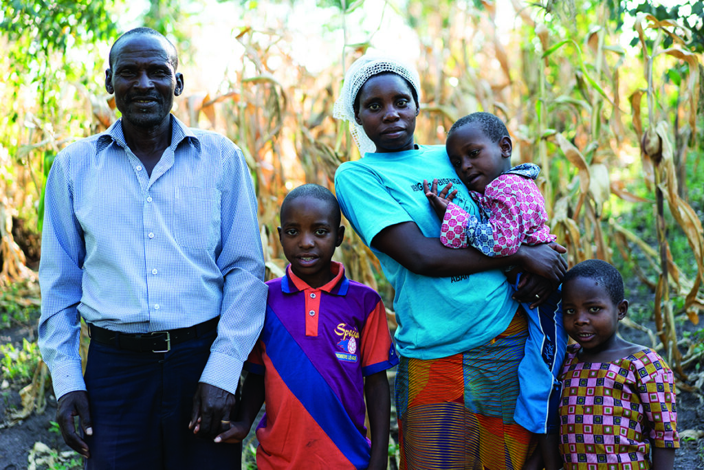 Reunited with his family after years in an orphanage, Carrol (in his mother’s arms) now has the love he needs to thrive
