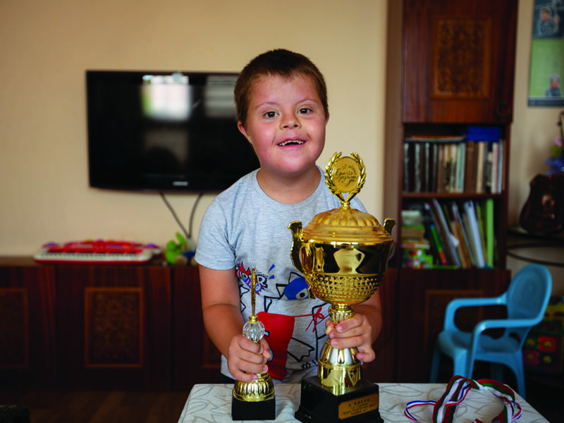 Georgi loves to go fishing and he’s very proud of all the trophies he’s won.