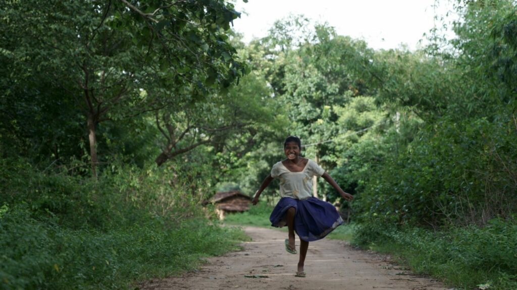 Sonia, who we worked with in India, running and laughing