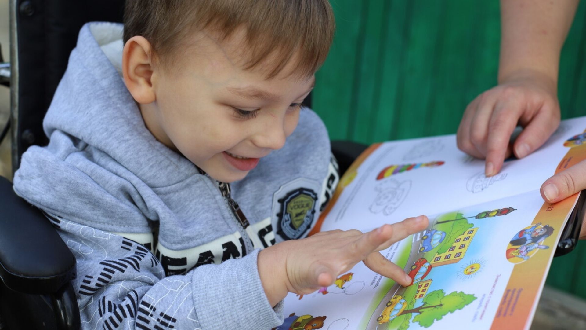 Vasilica and Ecaterina enjoy looking at picture books. They have been reunited thanks to our programmes in Moldova