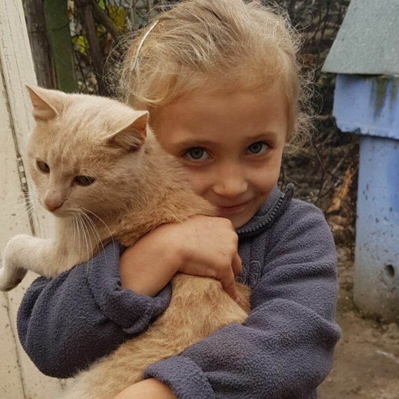 Violeta, a Moldovan child we have worked with in our programmes alongside CCF Moldova, with her cat
