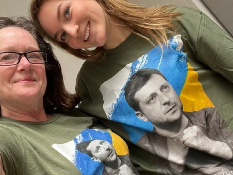 Deborah and Lilly fundraising for Hope and Homes for Children's Ukraine Appeal. They are both wearing t-shirts featuring President Zelensky