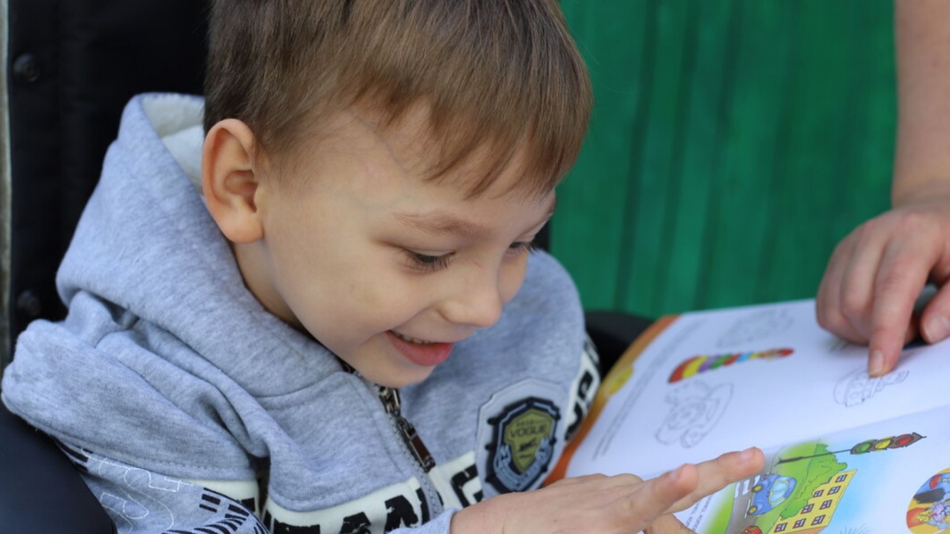 Vasilica, from Moldova, reading a book