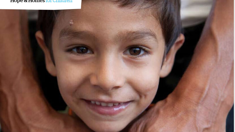 Report cover showing a young Bosnian boy's smiling face