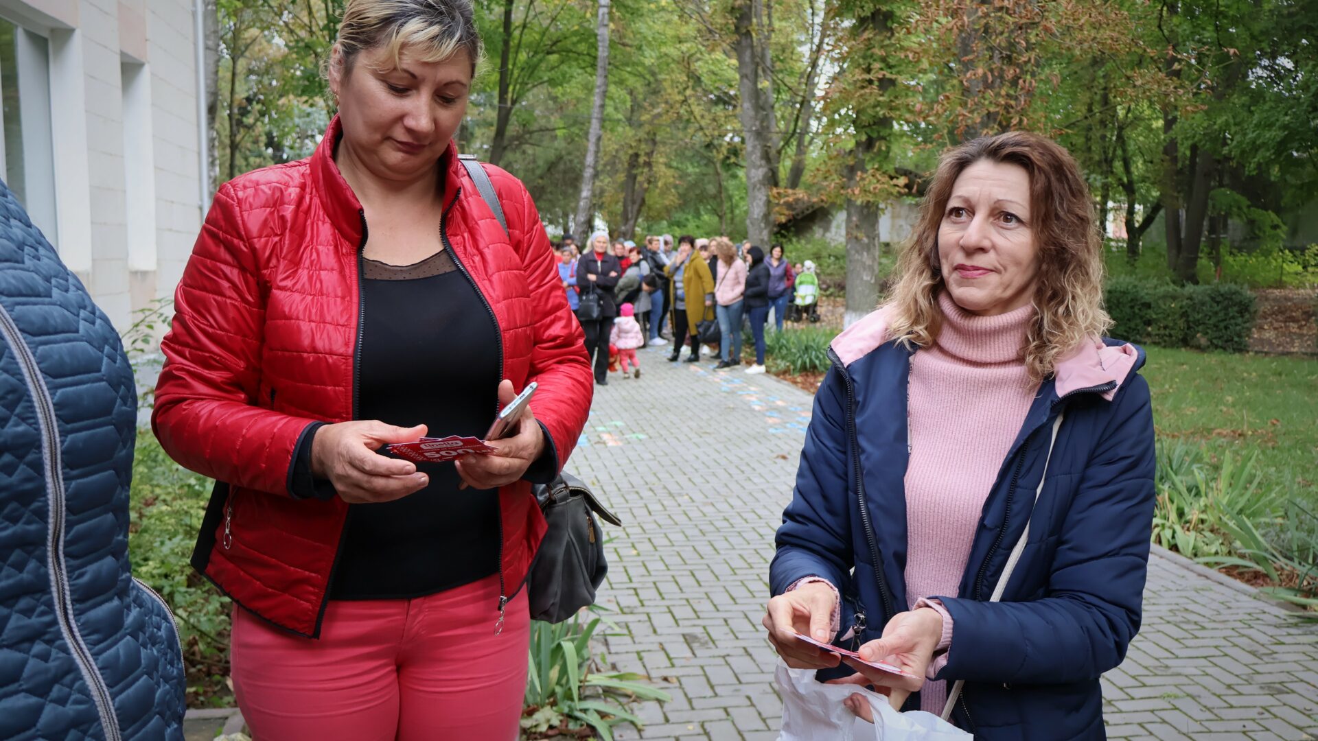 Social workers from CCF Moldova go out to foster families' homes to give out food vouchers