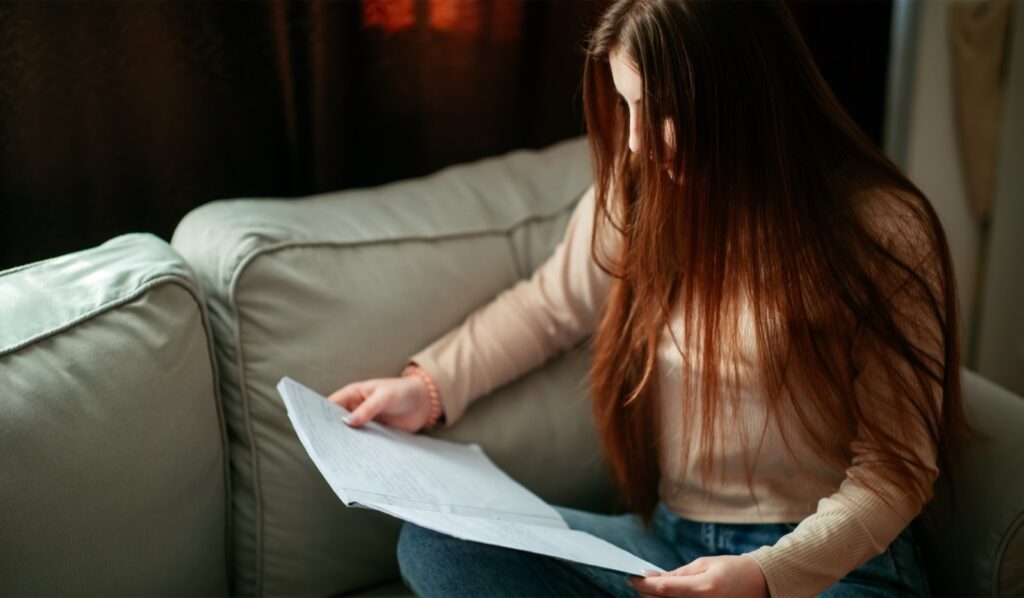 Image: Daryna studying inside her new room, shared with three friends, in Bucharest. 
