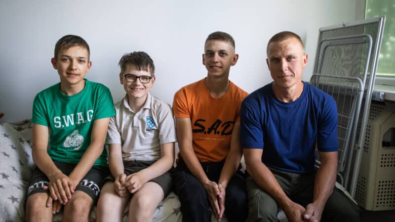 Kyrylo* adopted his nephews after their home was destroyed by Russian troops. Now, we're supporting him to keep his family together.
