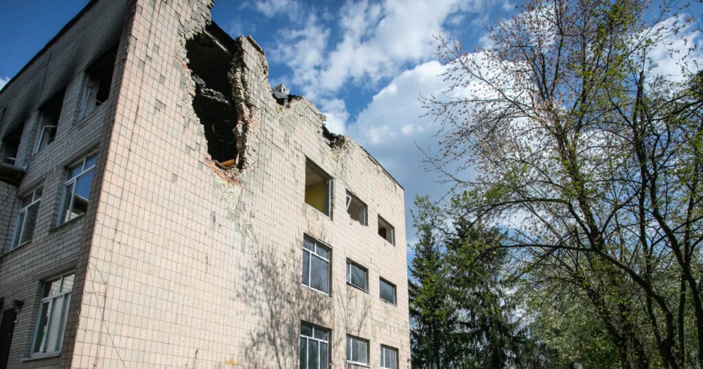A photo of a residential building in Kyiv. A huge hole has been blasted in the side of the building – remnants of a Russian airstrike. 
