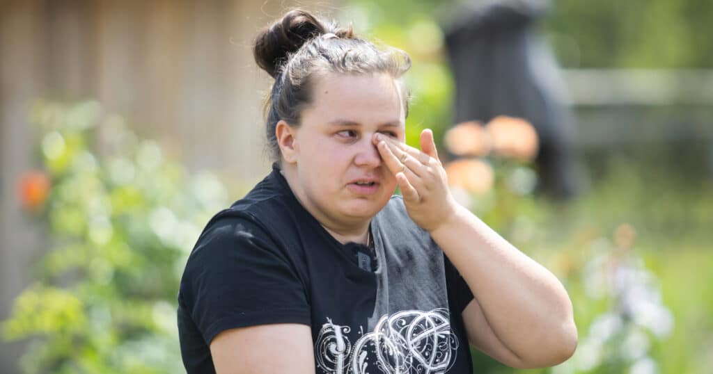 Tina, 22, wipes tears from her eyes as she recalls the day her fiancé was killed by Russian troops.