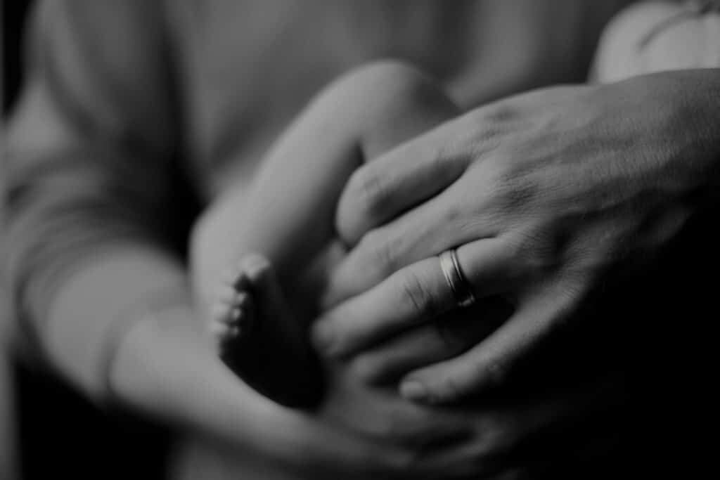 A parent holding their baby.