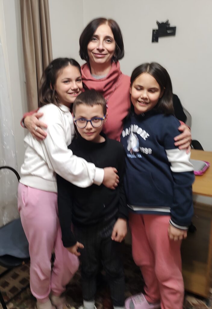 Carmen with Sandra*, Siminia*, and Antonio*