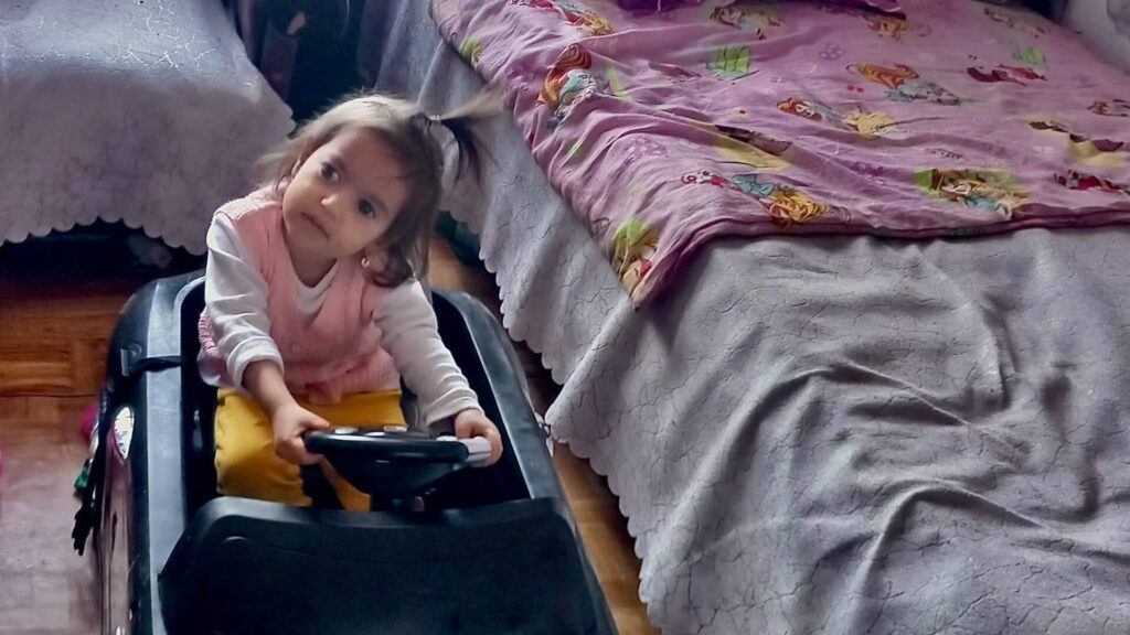 Ivanka plays in a toy car